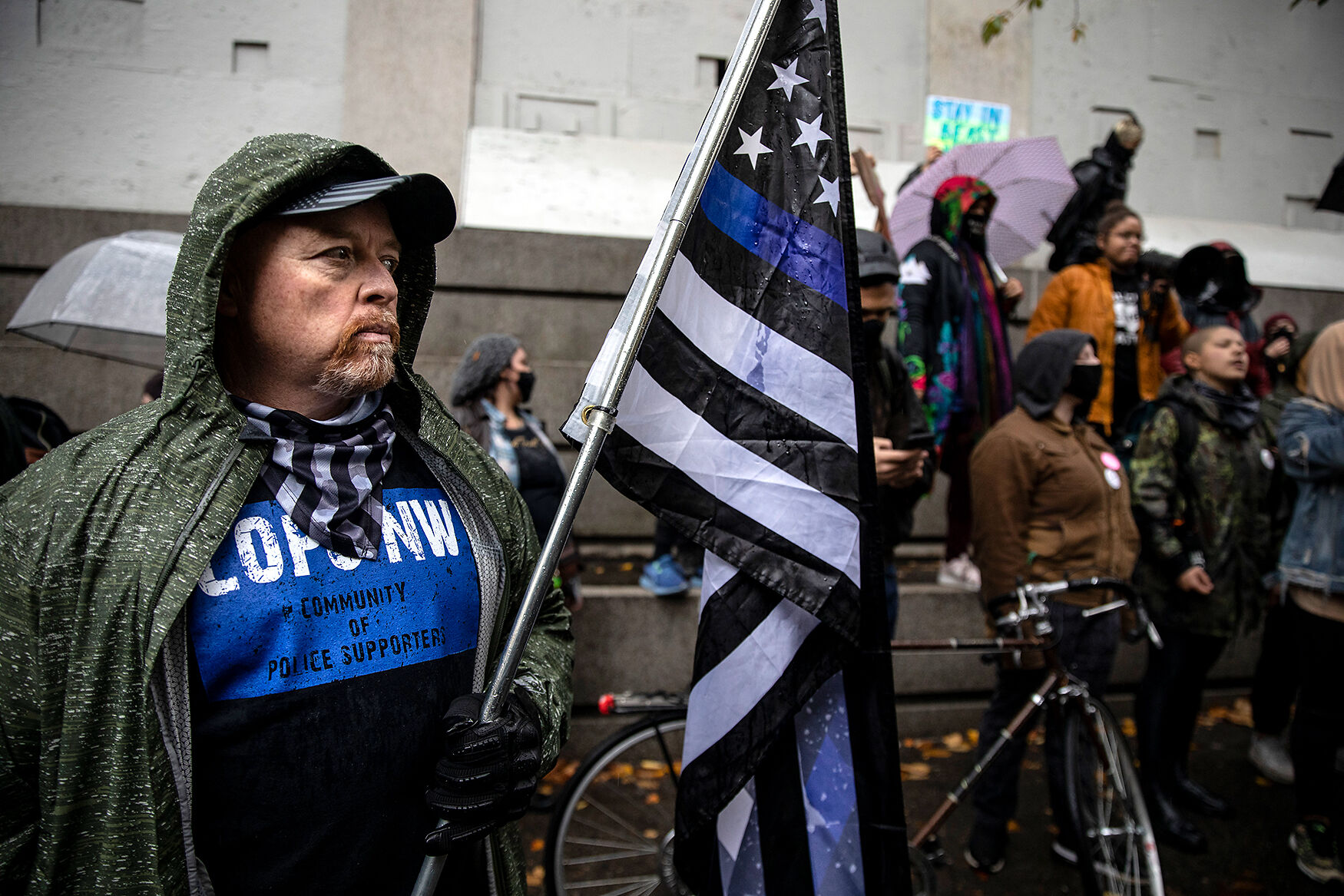 Back The Blue supporters stand next to Black Lives Matter supporters